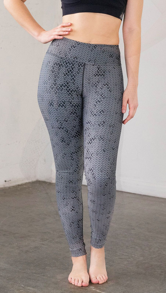 Front view of model wearing chainmaille inspired full length leggings