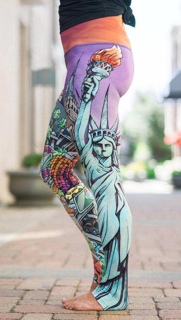 closeup left side view of model wearing full length printed leggings with various cities design