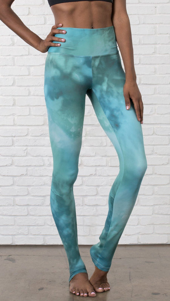 close up view of model wearing water / ocean themed printed full length leggings