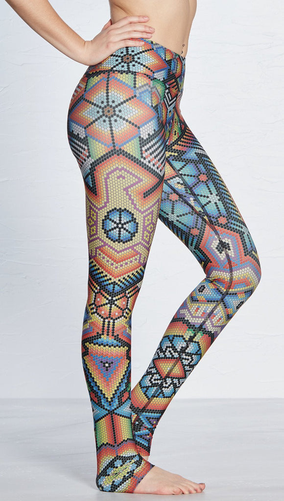 closeup right side view of model wearing beaded themed printed full length leggings with eagle motif