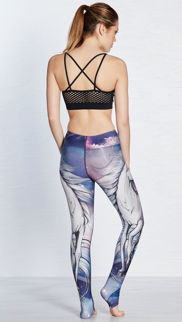 back view of model wearing unicorn design printed full length leggings