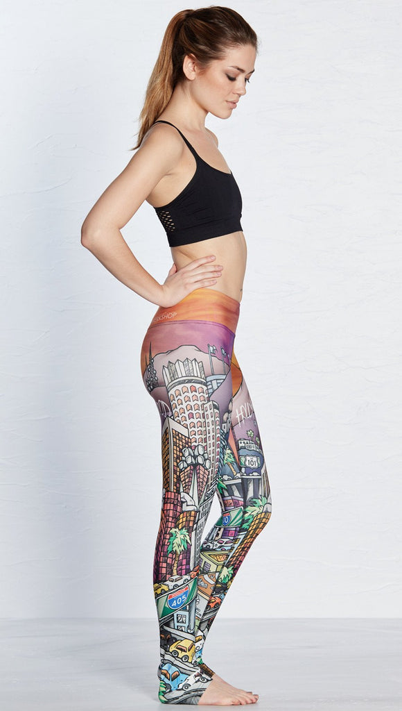 right side view of model wearing los angeles themed printed full length leggings