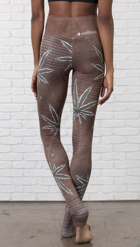 close up back view of model wearing cannabis leaf printed full length leggings