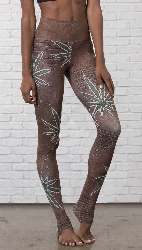 close up front view of model wearing cannabis leaf printed full length leggings