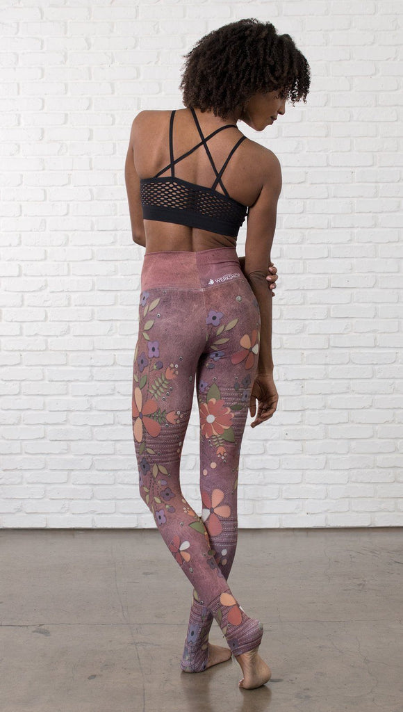 close up back view of model wearing vintage flower pattern printed full length leggings