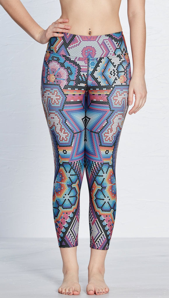 close up front view of model wearing latin beads themed printed capri leggings with lizard design