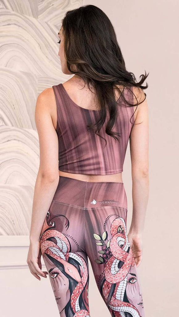 Back view of model wearing a mauve color sleeveless crop top with black brushstrokes