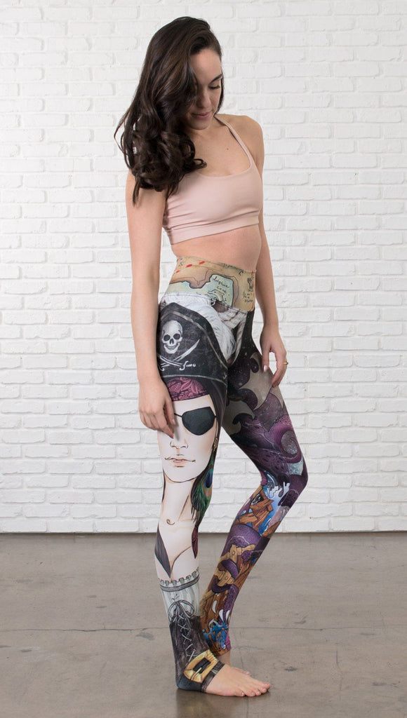 front view of model wearing pirate girl mashup themed printed capri leggings