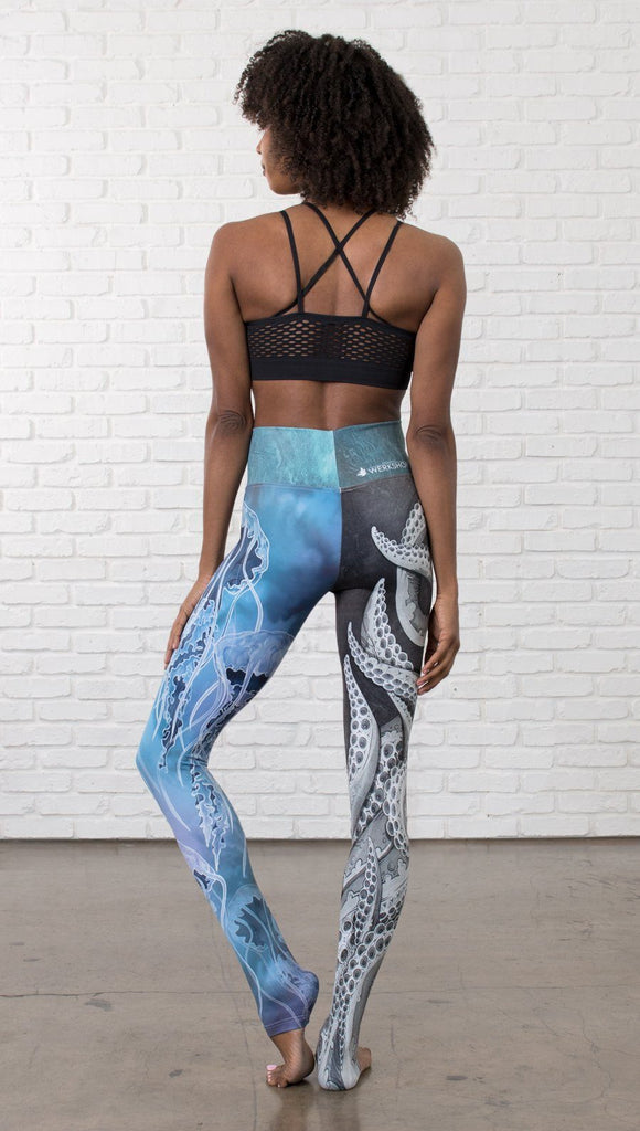 back view of model wearing ocean themed tentacles and jellyfish mashup design printed full length leggings