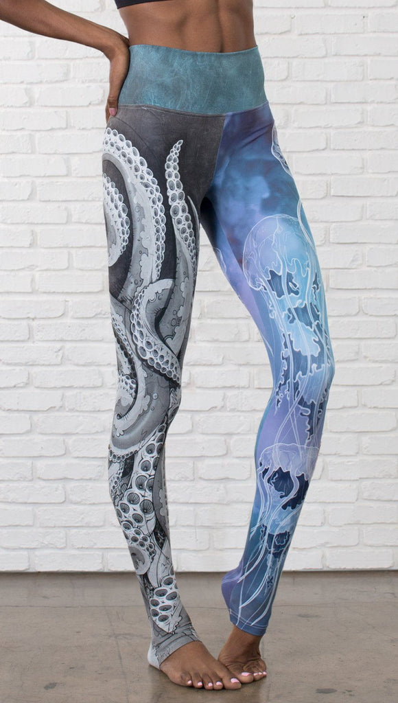 closeup front view of model wearing ocean themed tentacles and jellyfish mashup design printed full length leggings
