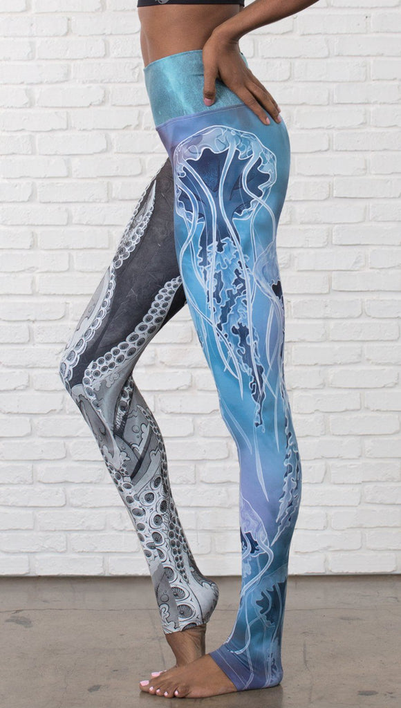 closeup left side view of model wearing ocean themed tentacles and jellyfish mashup design printed full length leggings