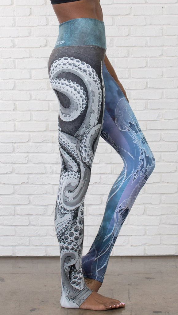 closeup right side view of model wearing ocean themed tentacles and jellyfish mashup design printed full length leggings