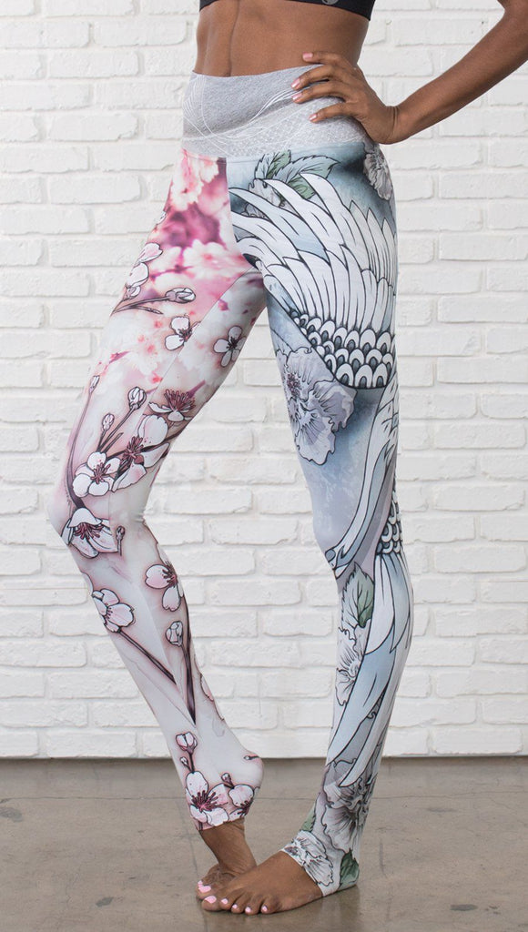 closeup left side view of model wearing Cherry Blossom, Swooping Crane and Koi Fish themed printed full length leggings