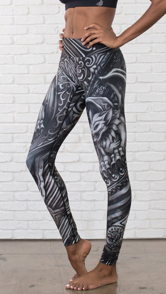 closeup front view of model wearing galaxy themed printed full length leggings