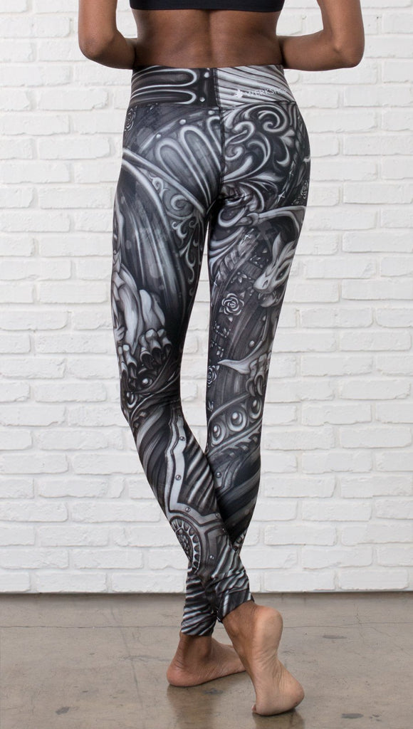 closeup back view of model wearing galaxy themed printed full length leggings