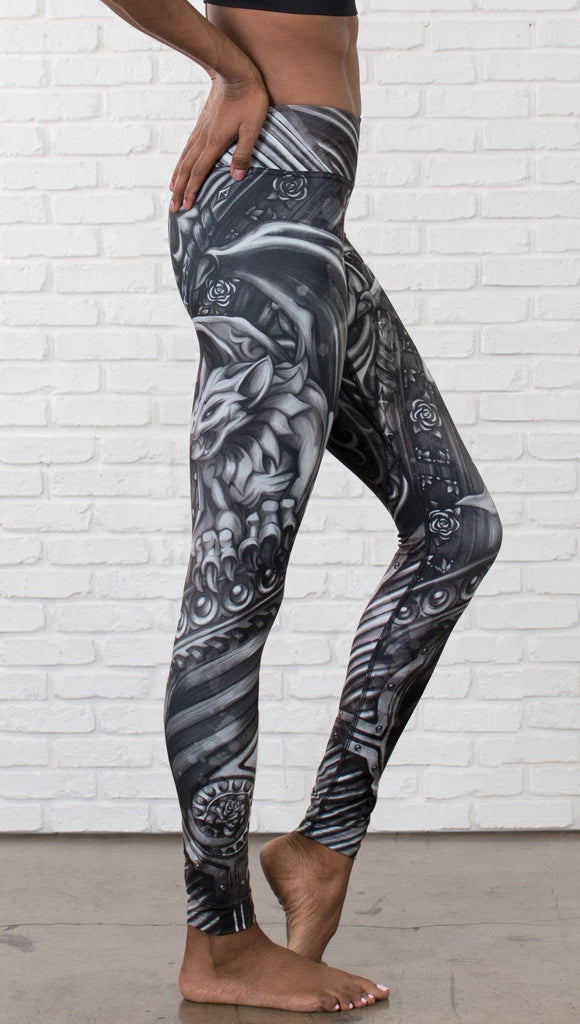 closeup right view of model wearing galaxy themed printed full length leggings