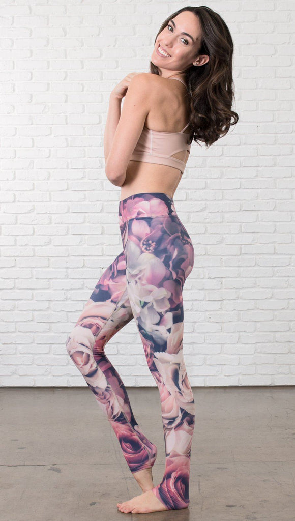 left side view of model wearing romantic flower printed full length leggings