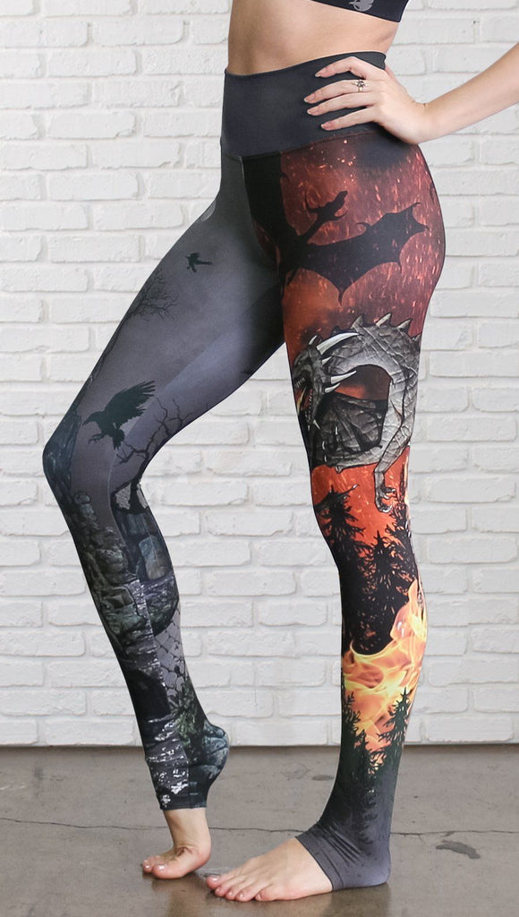 closeup left side view of model wearing fire breathing dragon and castle mashup theme printed full length leggings