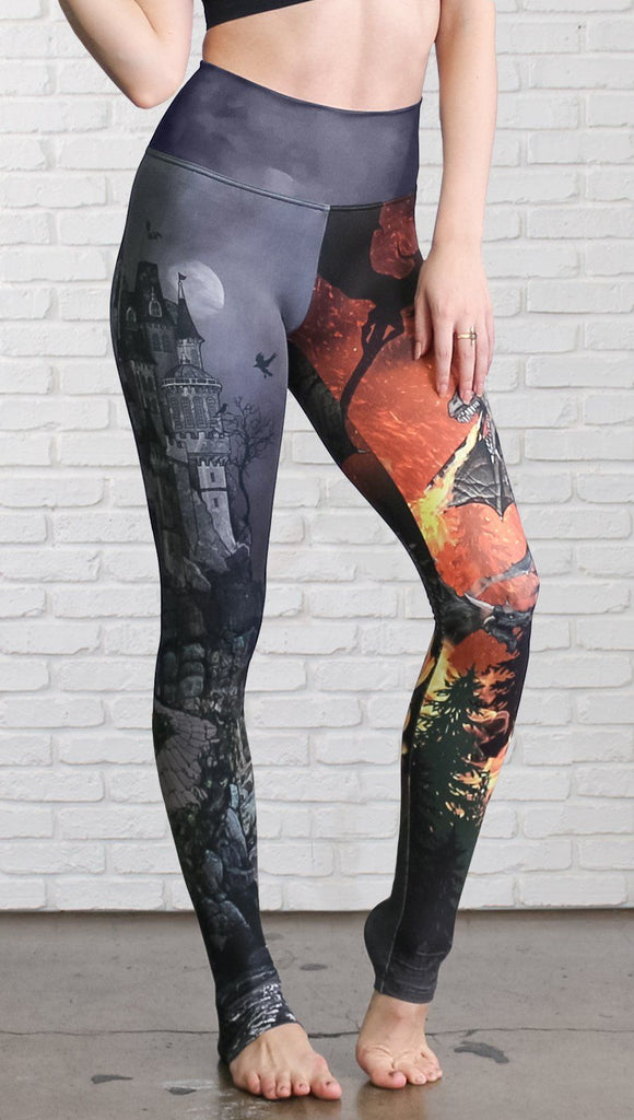closeup front view of model wearing fire breathing dragon and castle mashup theme printed full length leggings