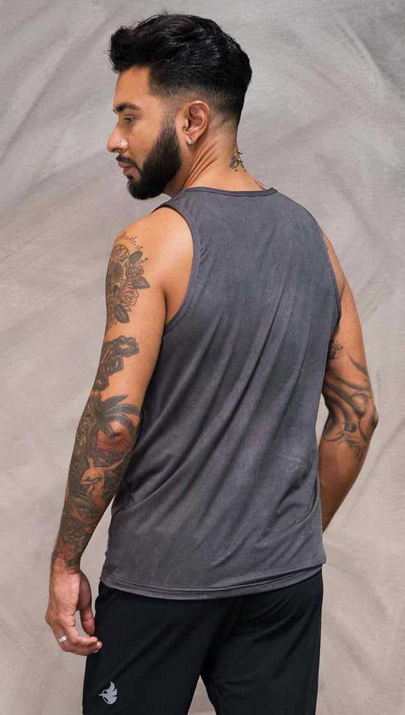 Close up back view of model wearing gray tank top