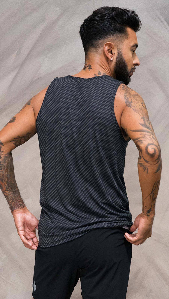 Close up back view of model wearing black tank top with carbon fiber inspired art