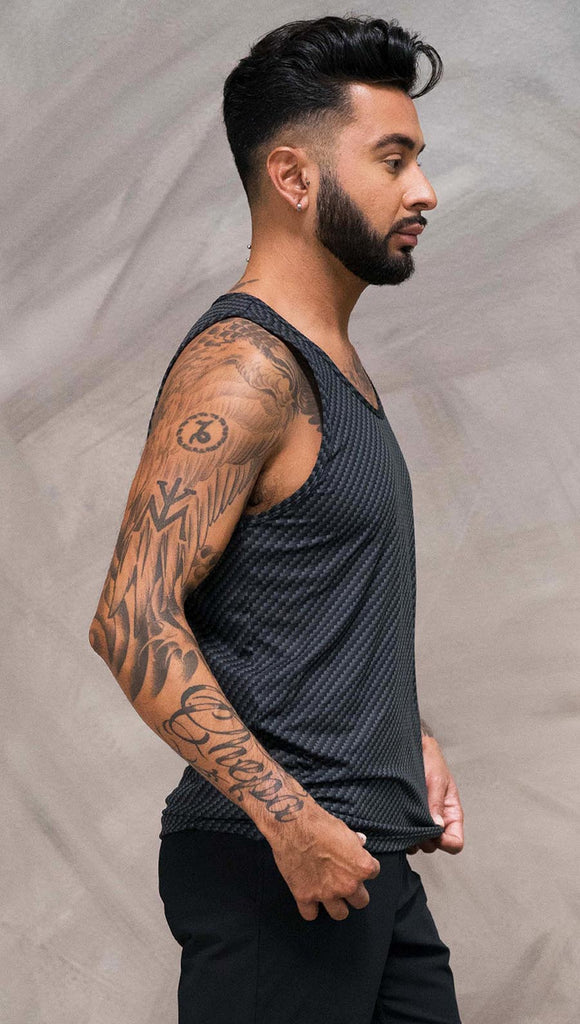 Close up right side view of model wearing black tank top with carbon fiber inspired art