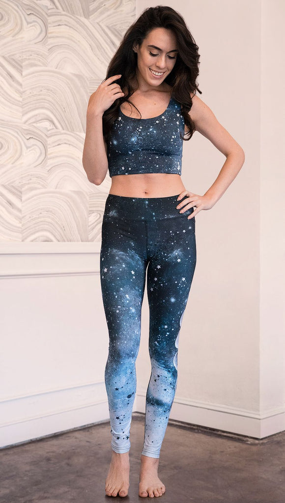 front view of model wearing moon cycle themed full length leggings