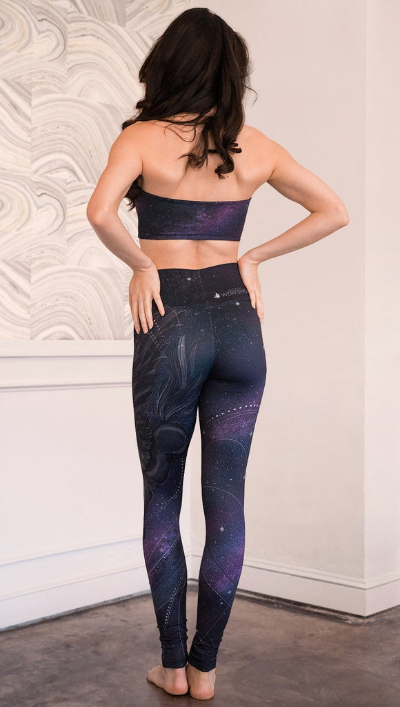 back view of model wearing fantasy flying pegasus themed printed full length leggings