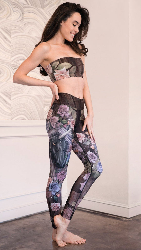 right side view of model wearing unicorn themed full length leggings
