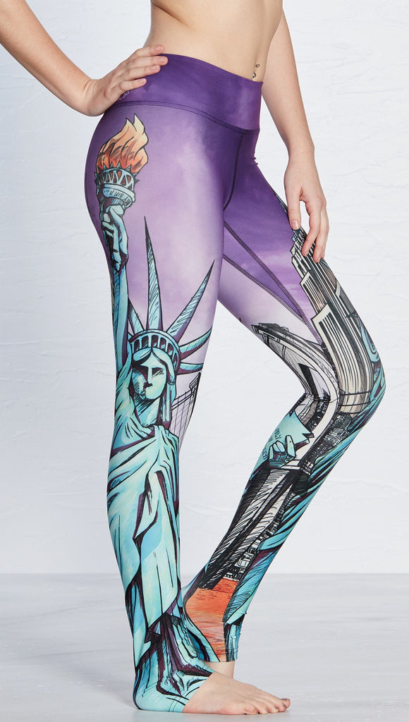 closeup right side view of model wearing new york themed printed full length leggings