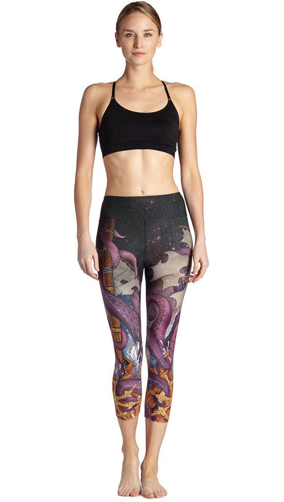 front view of model wearing mythical octopus themed printed capri leggings