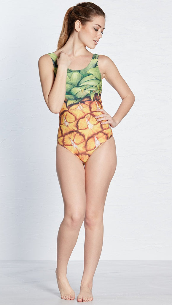 front view of model wearing pineapple themed one piece swimsuit / leotard 
