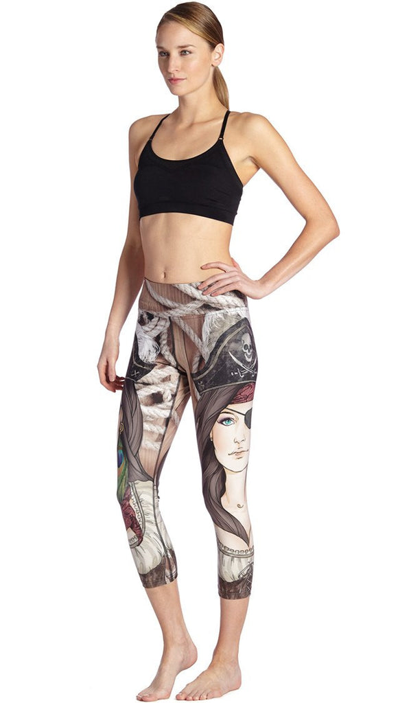 front view of model wearing pirate girl themed printed capri leggings