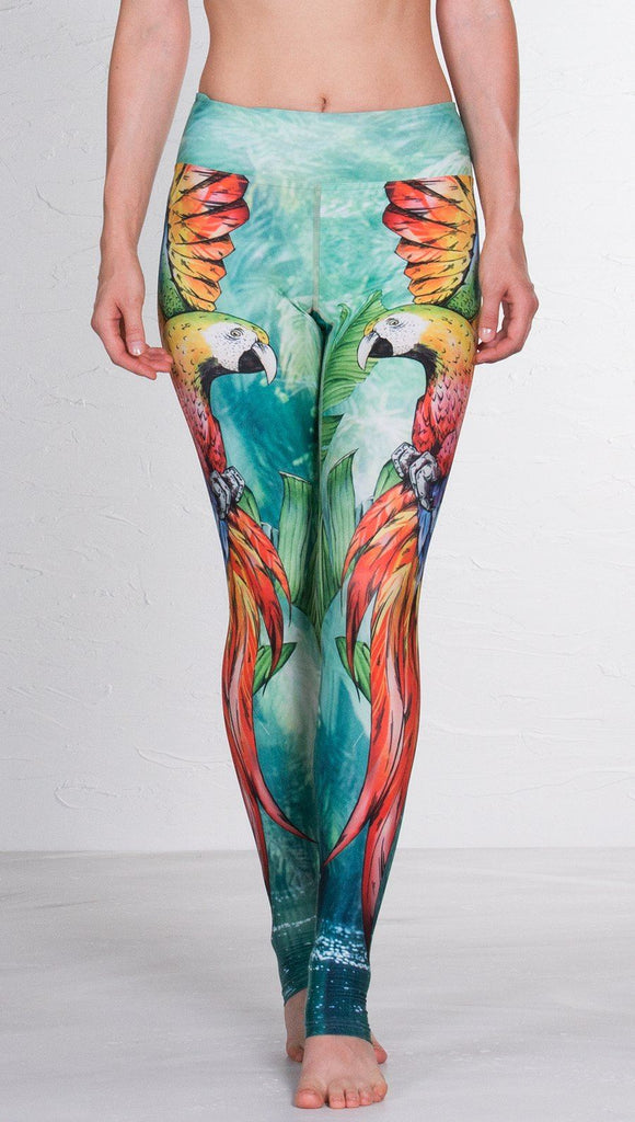 closeup front view of model wearing macaw themed full length leggings
