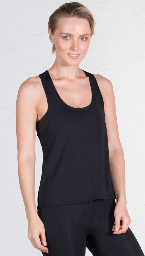 closeup front view of model wearing black sports tank top