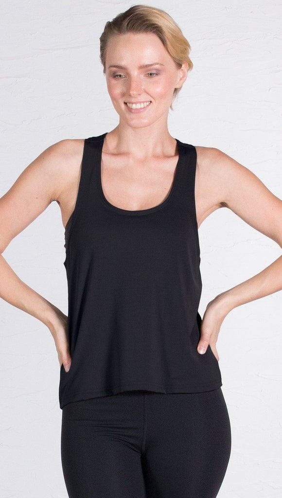 closeup front view of model wearing black sports tank top