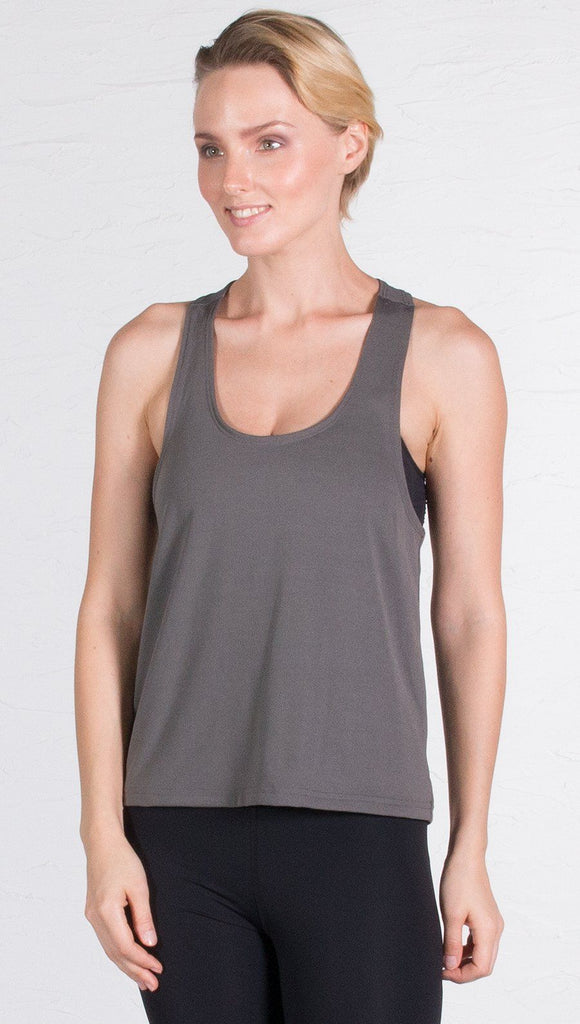 closeup front view of model wearing gray sports tank top