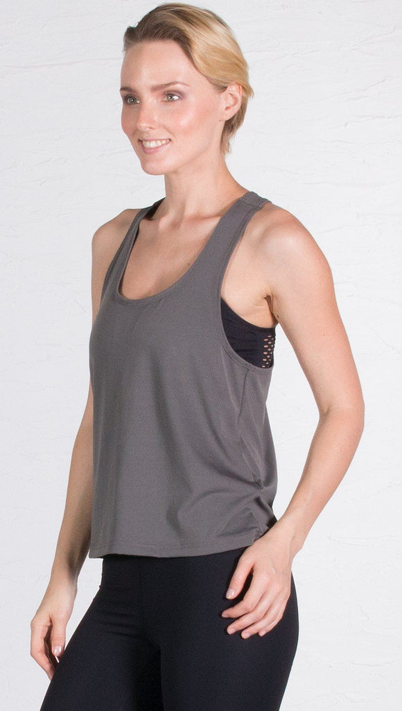 closeup front view of model wearing gray sports tank top