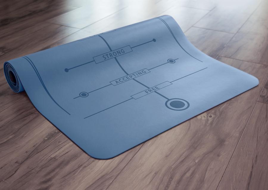 Partially rolled blue yoga mat on floor