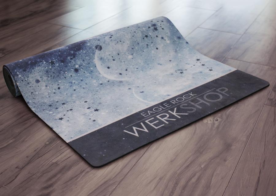 view of partially rolled up moon cycle themed yoga mat