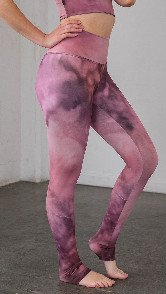 closeup right side view of model wearing rose quartz stone design printed full length leggings