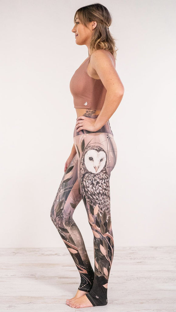 Side view of model wearing owl themed full length leggings