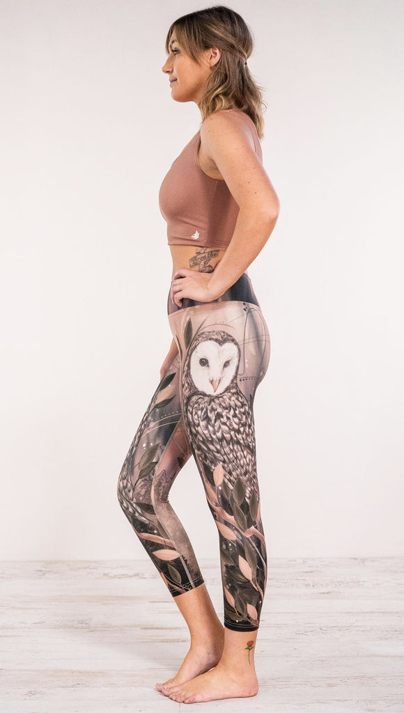 Side view of model wearing owl themed leggings