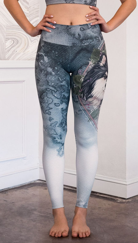 closeup front view of model wearing full length Finnish Lapphund artwork themed leggings