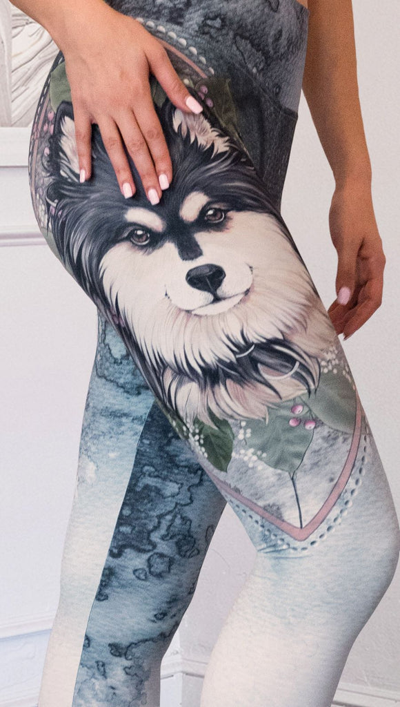 closeup right side view of model wearing full length Finnish Lapphund artwork themed leggings