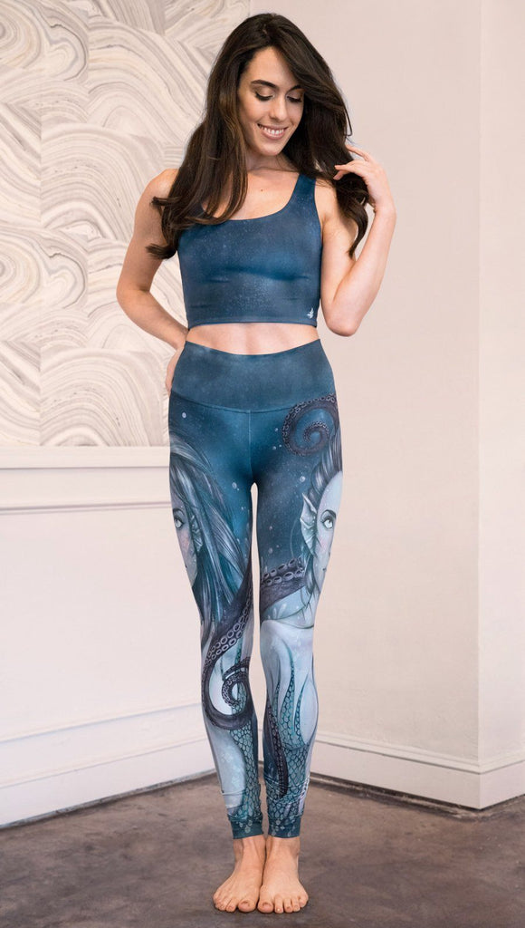 front view of model wearing full length leggings with mermaid and tentacles printed design