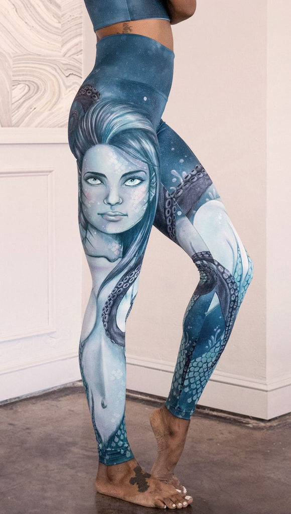 closeup right side view of model wearing full length leggings with mermaid and tentacles printed design