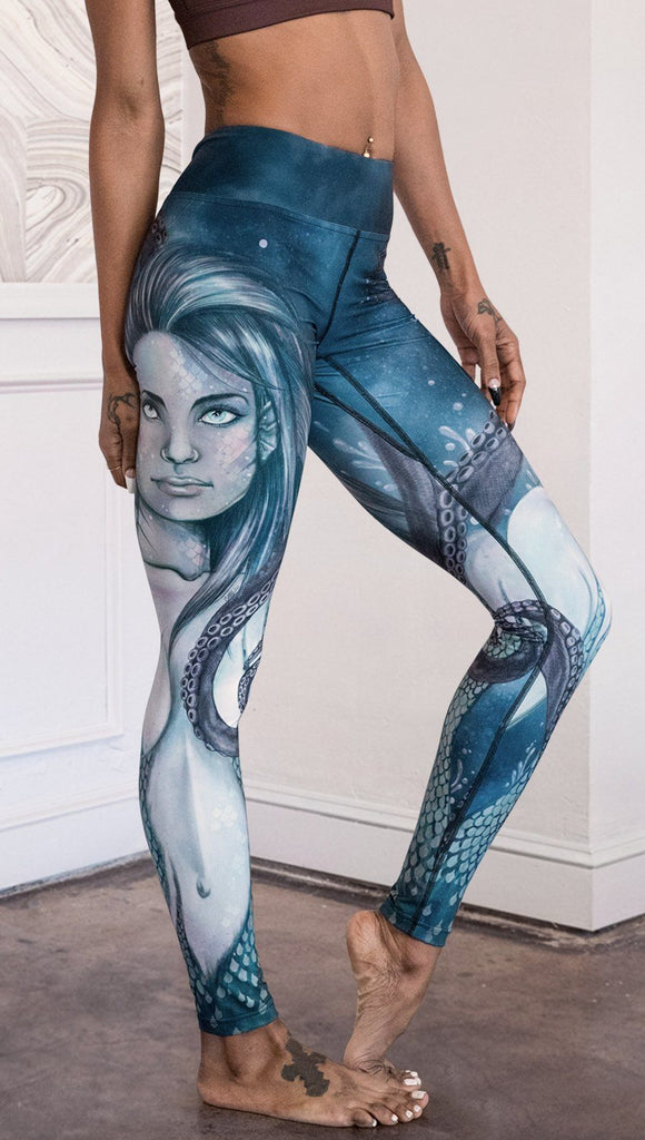 closeup right side view of model wearing full length leggings with mermaid and tentacles printed design