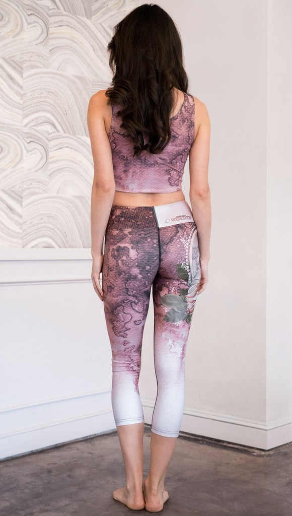 back view of model wearing pink/mauve Icelandic Sheepdog capri leggings with Original Tattoo-Inspired artwork