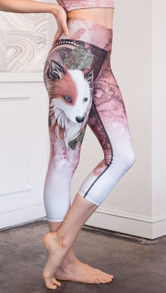 closeup right side view of model wearing pink/mauve Icelandic Sheepdog capri leggings with Original Tattoo-Inspired artwork